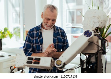 Successful Inventor. Happy Nice Man Smiling While Being Excited About New Technology