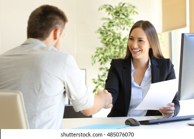 Successful job interview with boss and employee handshaking - Shutterstock ID 485076070