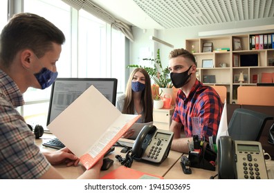 Successful Lawyer In Protective Mask Giving Consultation To Family Couple About Buying House