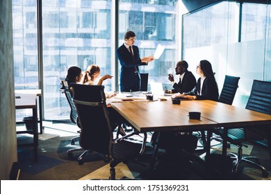 Successful leadership explaining strategy plan during together training at conference table, male and female professional colleagues research solutions during productive brainstorming in office - Shutterstock ID 1751369231