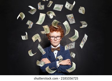 Successful Little Kid Boy Standing With Crossed Hands Under Us Dollar Money Rain On Black Background