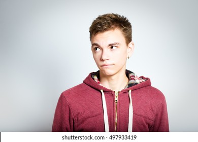 Successful Man Embarrassed, Isolated On A Gray Background