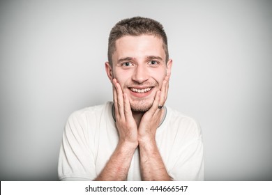 Successful Man Pleasantly Surprised By The News, Isolated On A Gray Background