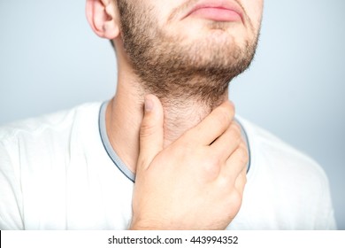 Successful Man With Strep Throat, Isolated On A Gray Background