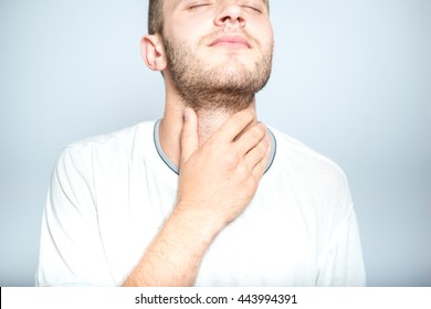 Successful Man With Strep Throat, Isolated On A Gray Background