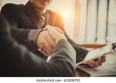 Successful meeting. Two Confident businessman firmly shake hands with each other  - Shutterstock ID 651838792