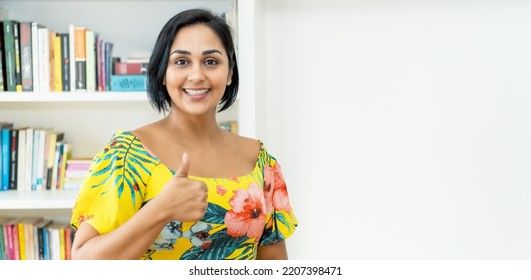 Successful Mexican Mature Adult Woman Showing Thumb Up Indoors At Home