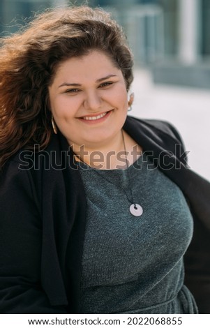 Similar – Happy curvy girl with curly hair