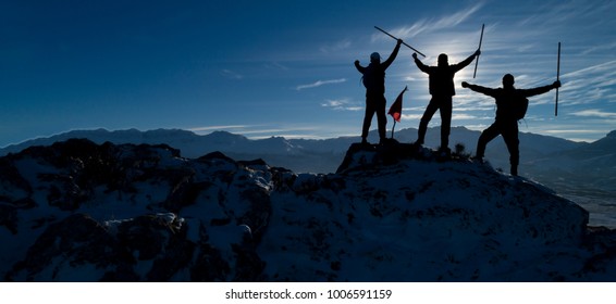 successful mountaineers silhouette - Shutterstock ID 1006591159