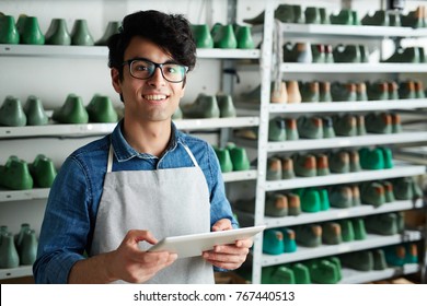 Successful Owner Of Cobbler Shop Taking Online Orders At Workplace