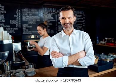 Successful Restaurant Manager Small Business Owner Standing In Cafe