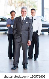 Successful Sales Staff At A Car Dealership