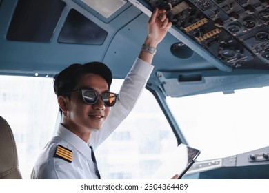 Successful serious airplane captain pilot preparing for flight at Airport. - Powered by Shutterstock