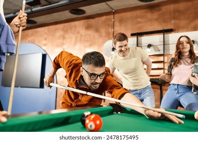 Successful startup team enjoying a game of pool in a stylish office, bonding and strategizing during a break. - Powered by Shutterstock