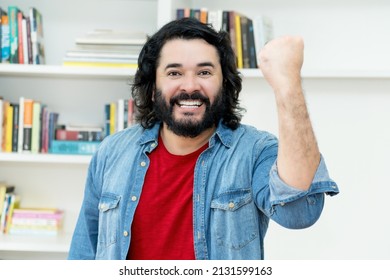 Successful strong man with full beard indoors at home