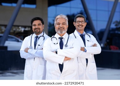 Successful team of medical doctors standing in hospital. - Powered by Shutterstock