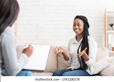 Successful Therapy. Happy Black Female Patient Talking To Psychologist At Her Office, Expressing Gratitude