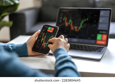 Successful of trader use smartphone and laptop trading stock exchange graph money of block chain stock market cryptocurrency selling and buy with price chart data graph,business financial funds - Shutterstock ID 2283804645