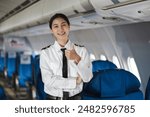 Successful trained airplane captain pilot preparing for flight at Airport.