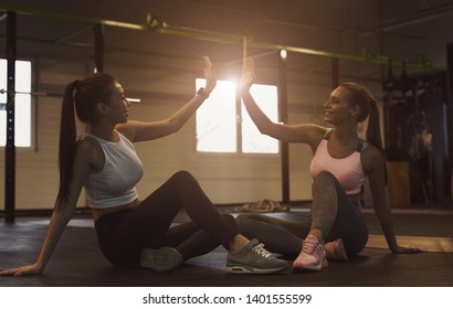 Successful Training. Women Giving High Five, Having Rest In Gym