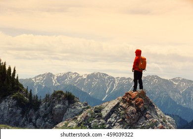  Successful Woman Backpacker Enjoy The View On Mountain Peak