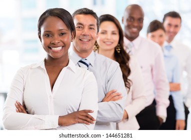 Successful woman leading a business group and looking happy