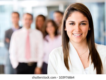 Successful woman at the office leading a business team