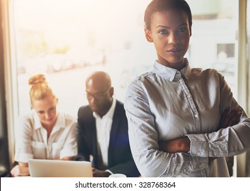 Successful Young Black Business Woman Standing In Front Of Multi Ethnic Group Of People