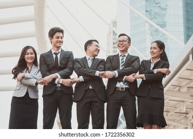 Successful young business people are raising hands and screaming with happiness, complete finish job, teamwork successful/achievement working
Successful entrepreneurs & business people achieving goal