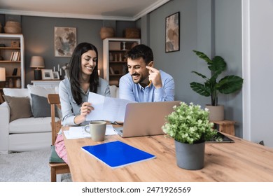 Successful young business people working together in home office. Couple teamwork startup concept video call presentation on laptop computer and webcam. Small company owners selling marketing ideas - Powered by Shutterstock