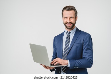 Successful young confident businessman using laptop for e-learning, remote work, watching webinar application online isolated in white background - Shutterstock ID 2142820425