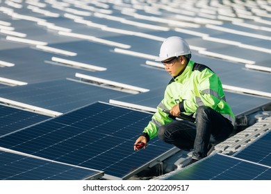 Successful Young Engineer In Uniform  Checks The Productivity Solar Panel Field For Examination