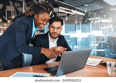 Successful young people working in a coworking space. African American Woman With Her Team Working With Laptop Discussing Strategy And Business Plan In Modern Office. - Powered by Shutterstock