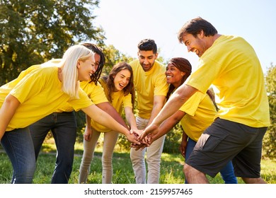 Successful young start-up team stacking hands for motivation and community - Shutterstock ID 2159957465