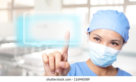 Successful Young Woman Surgeon Doctor Making Use Of Innovative Technologies, She Press Touchscreen With Empty Button Copy Space, Asian Model