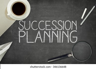 Succession planning concept on blackboard with pen