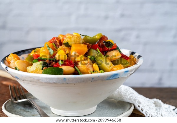 Succotash - Southern
American dish with vegetables, butter beans,  butternut squash,
sweetcorn and chorizo