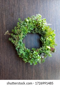 Succulent Decorative Wreath On Wooden Table