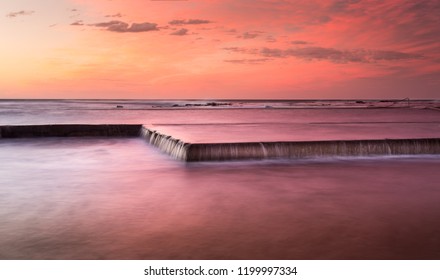 Such Pretty Skies Overhead Reflect In Rushing Waters Of The Pool Overflowing Onto Rocks, Unseen.