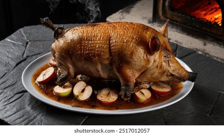 Suckling Pig: Succulent, roasted suckling pig with a crispy, golden skin and tender, juicy meat, seasoned with aromatic herbs and served with apple and sage stuffing. - Powered by Shutterstock