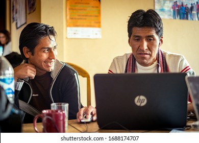 Sucre, Chuquisaca / Bolivia - February 27 2015: Brown Man With Indigenous Features Using A Laptop In A Small Room