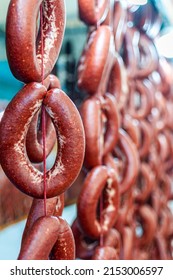 Sucuk, A Fermented Spicy Turkish Sausage Made With Ground Beef, Spices And Animal Fat Hanging In Rows And Displayed For Sale At A Regional Food Market; Traditionally Cooked For Breakfast With Eggs