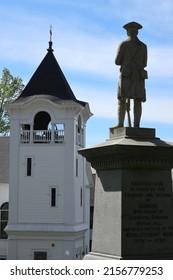 Sudbury, Massachusetts USA May 14, 2022:  Revolutionary War Statue Overlooks First Presbyterian Church.