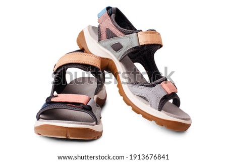 Suede sandals, velcro straps, flat sole white background isolated close up, trekking sandal shoes, pair of nubuck leather sport footwear, two summer colorful walking boots, casual comfortable footgear