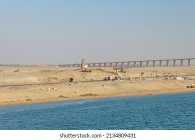 Suez Canal, Egypt - Mar 27 2013: War Memorial North Side Of Al Salam Bridge, Seen Onboard From A Vessel Transiting The Suez Canal.