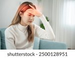 Suffer from headache desperate and stressed because pain and migraine. asian young man suffering migraine pain while working, blue isolated background, brain tumor, high cholesterol effect