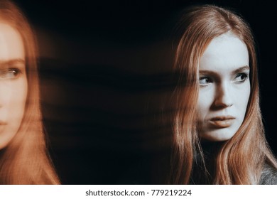 Suffering Girl With Psychosis And Split Personality. Photo Of Blurred And Multiple Faces Against Black Background