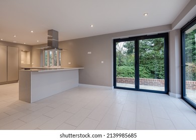 Suffolk, England - December 16 2016: Unfurnished Modern Kitchen With Bifold Patio Doors