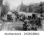 Suffrage hikers on way to Washington walking through Newark, New Jersey on Broad Street, February 12, 1913. The hike was organized and led by 