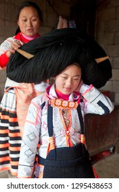 Sugao, China - January 2012: Preparing hair, Long Horn Miao, Sugao, Guizhou Province, China